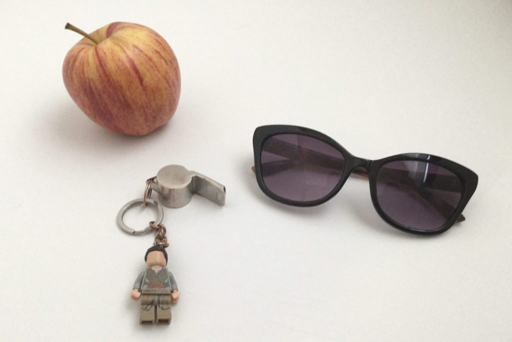 Sports whistle with apple and sunglasses.
